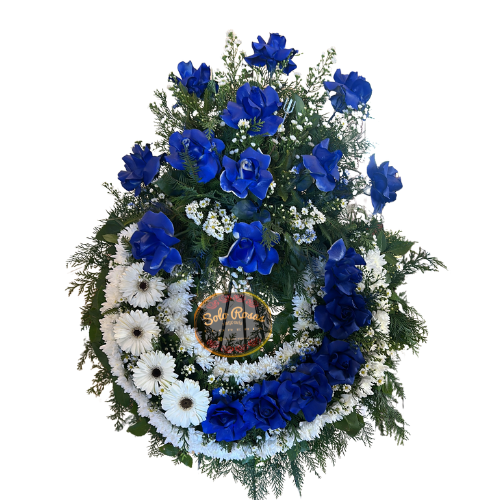 corona de rosas azules con gerberas y maule